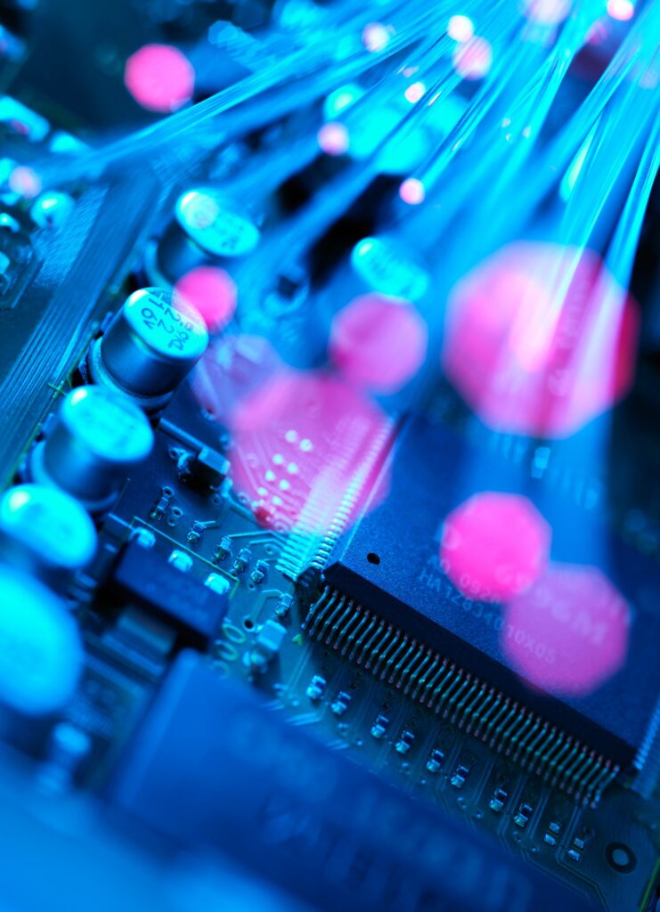 Fibre optics carrying data passing across electronic circuit board